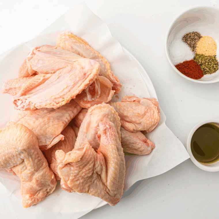 Ingredients needed for Air Fryer Honey Mustard Chicken Wings on kitchen table.