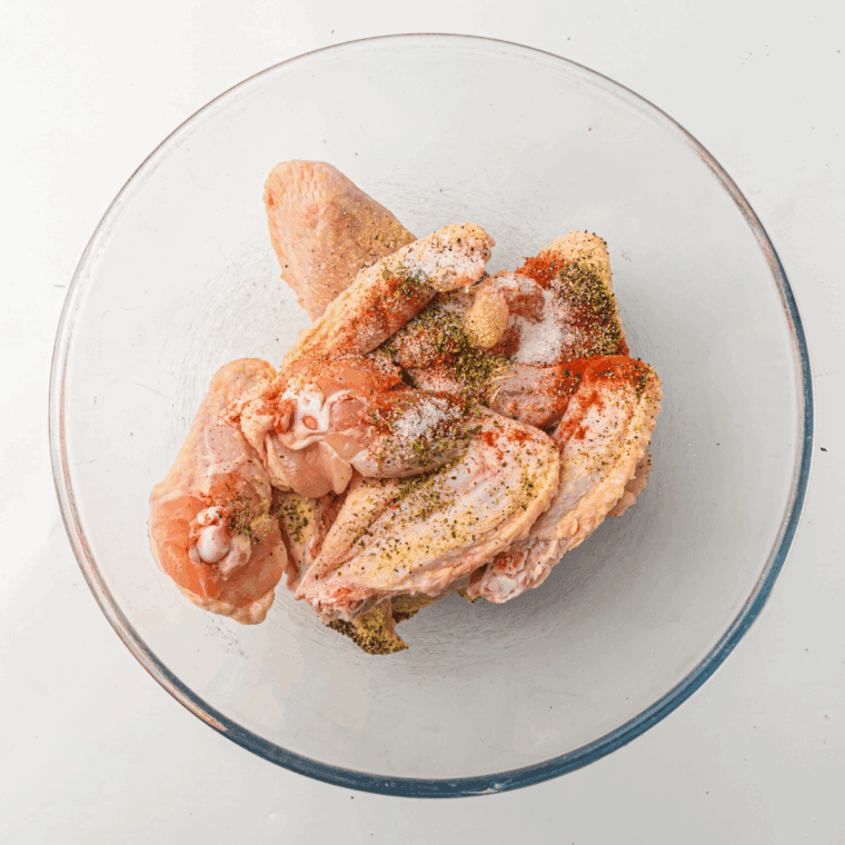 Season the chicken wings with seasonings and salt and pepper, toss well to coat.