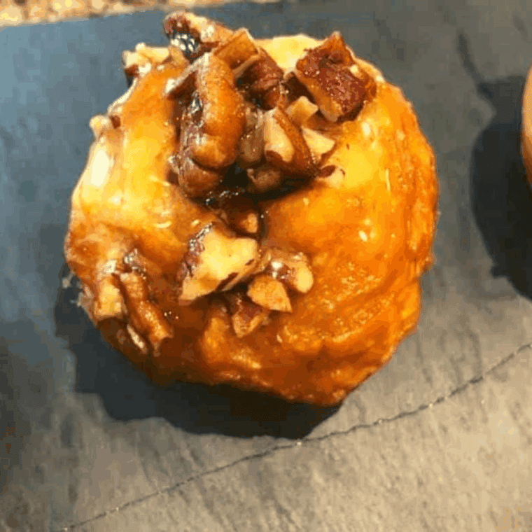 Plate of Air Fryer Pecan Rolls on kitchen table.