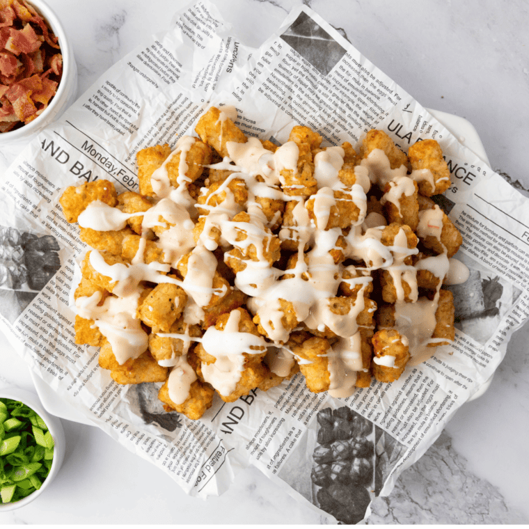 overhead: air fryer totchos with sour cream on top