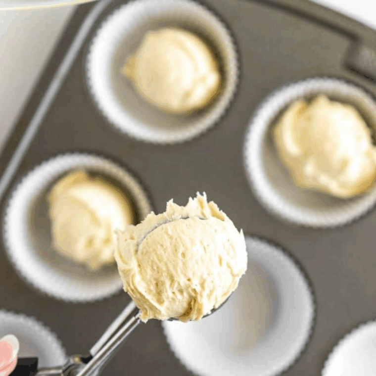 Cupcake pan prepared with liners and batter filled two-thirds full, air fried at 320°F until a toothpick comes out clean, then cooled slightly for decorating.