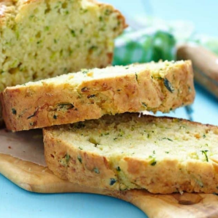 Baked zucchini bread loaf cooling on a wire rack