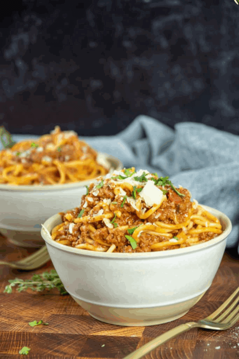 Plate of Carrabba's Spaghetti Recipe on kitchen table.