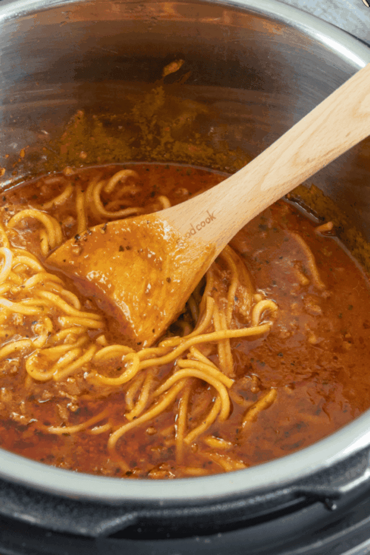 Place the pasta ingredients into the Instant Pot pressure cooker bowl.