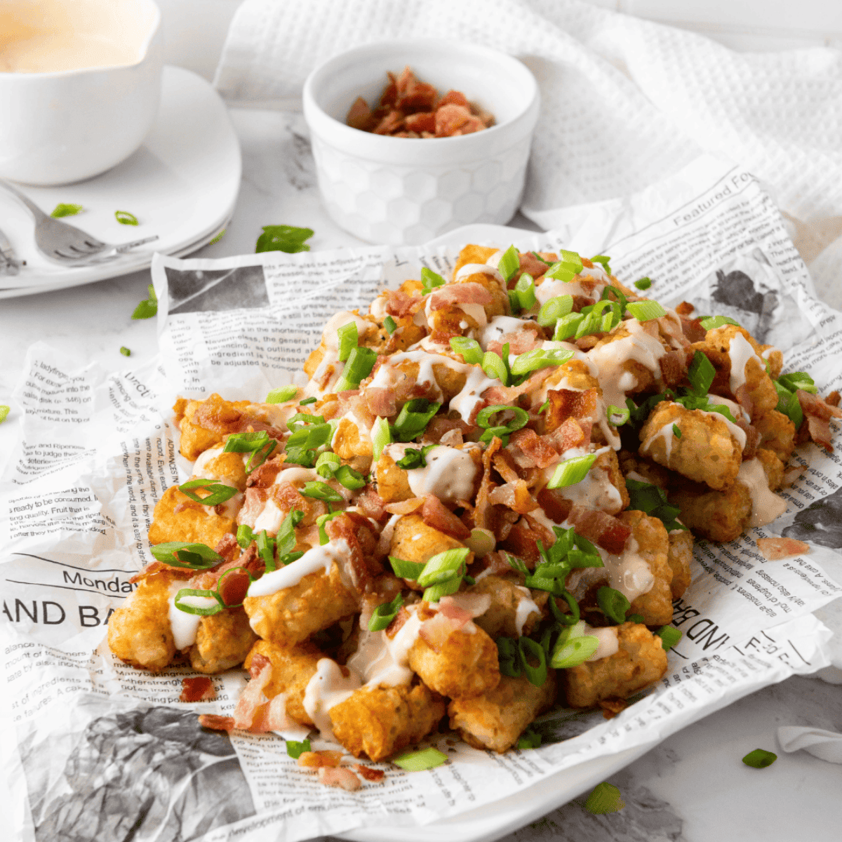 Plate of Copycat Domino’s Cheddar Bacon Loaded Tots with toppings.