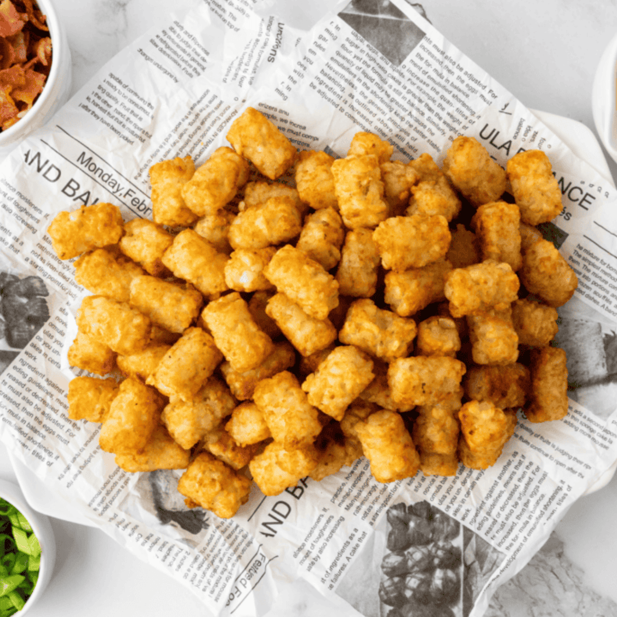 Ingredients needed for Copycat Domino’s Cheddar Bacon Loaded Tots on kitchen table.
