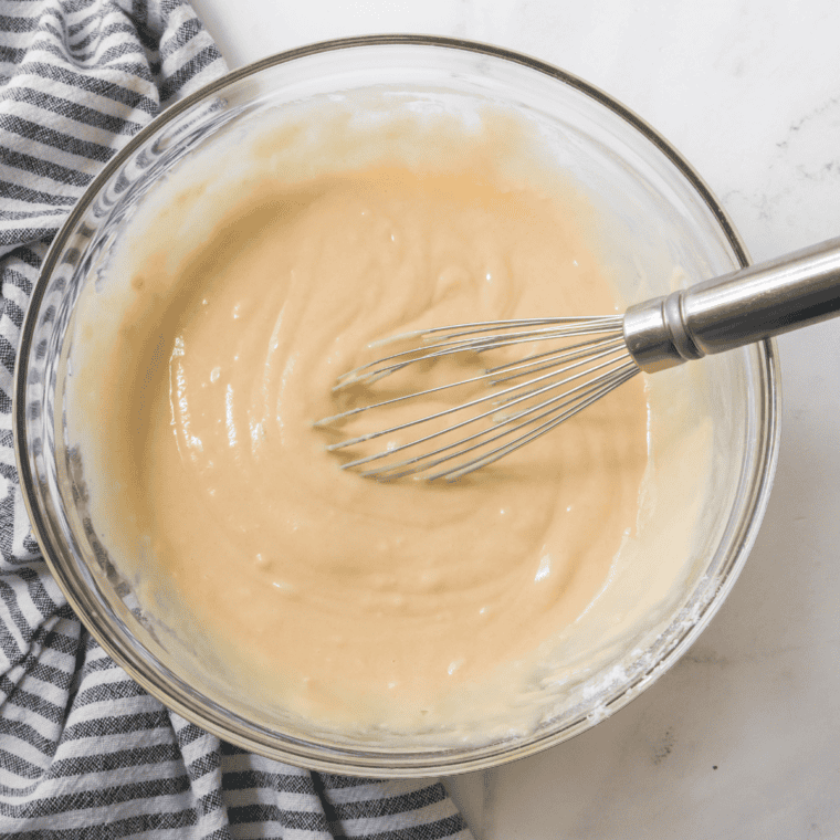 Flour, baking powder, baking soda, and salt whisked together in a mixing bowl