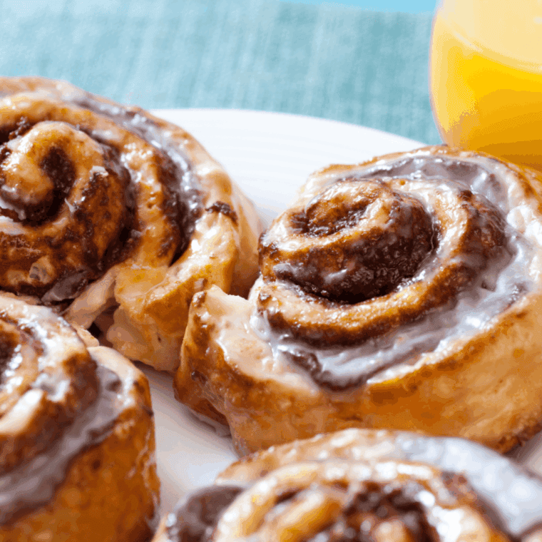 Freshly cooked cinnamon rolls made in air fryer from frozen bread dough.