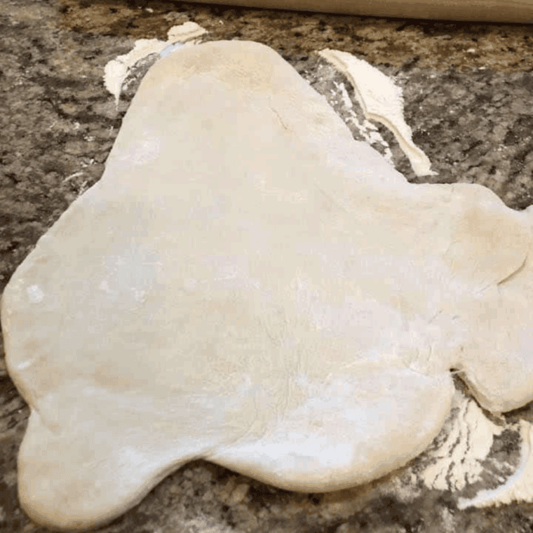 Roll out the dough with a rolling pin.