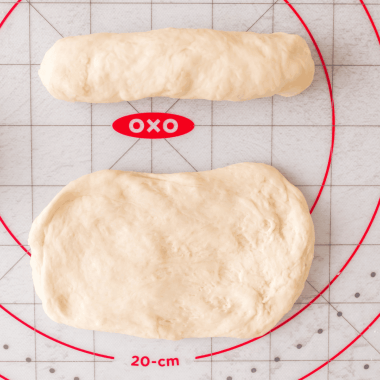 Shape the Breadsticks: Dough rolled into long, thin breadsticks on baking sheet.