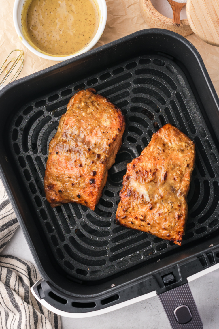 Air fryer frozen salmon cooked straight from frozen producing flaky tender texture with lightly crisp edges in just 16 minutes for a quick dinner