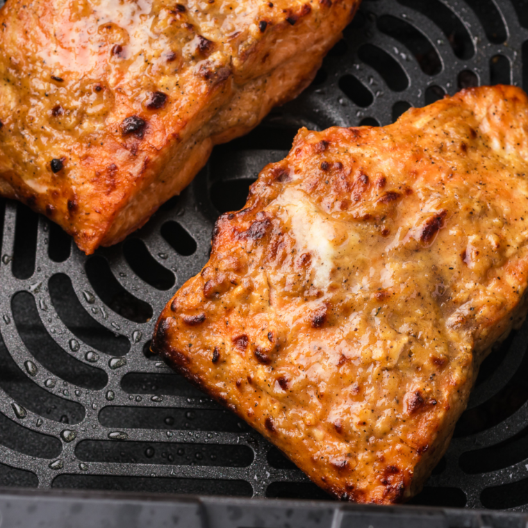 Air fryer frozen salmon cooked straight from frozen with flaky tender inside and lightly crisp exterior ready in 16 minutes for easy meal