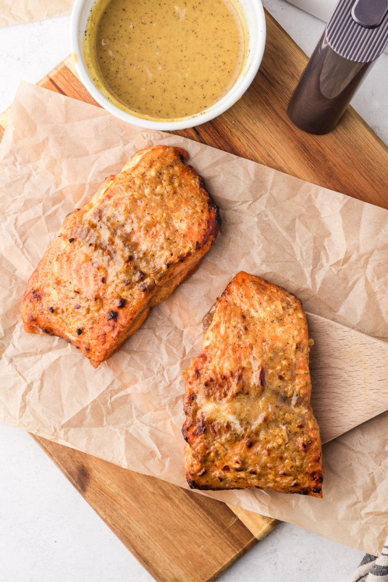 Air fryer frozen salmon cooked straight from frozen creating flaky tender texture with lightly crisp edges in 16 minutes for quick simple meal