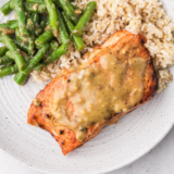 Air fryer frozen salmon cooked without thawing resulting in flaky tender fish with crisp edges ready in 16 minutes for quick easy dinner