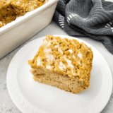 Golden Air Fryer Apple Coffee Cake topped with cinnamon sugar and fresh apple slices.