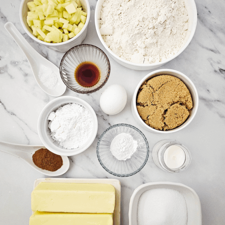 Ingredients needed for Air Fryer Apple Coffee Cake on kitchen table.