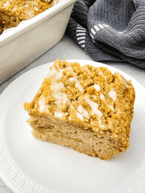 Golden Air Fryer Apple Coffee Cake topped with cinnamon sugar and fresh apple slices.