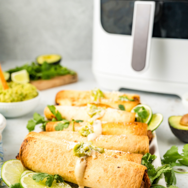 Crispy air fryer beef and bean taquitos filled with seasoned ground beef, refried beans, and melted cheese served with salsa