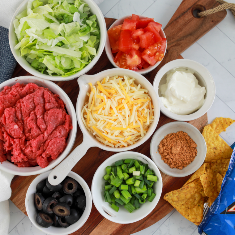 Ingredients needed for Air Fryer Beef and Bean Taquitos on kitchen table.