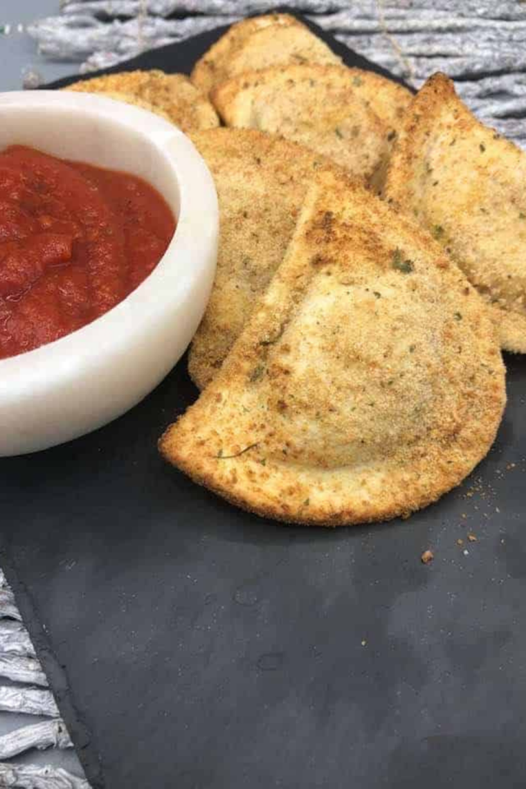 Golden-brown air fryer breaded pierogies served on a plate, crispy and ready to eat.