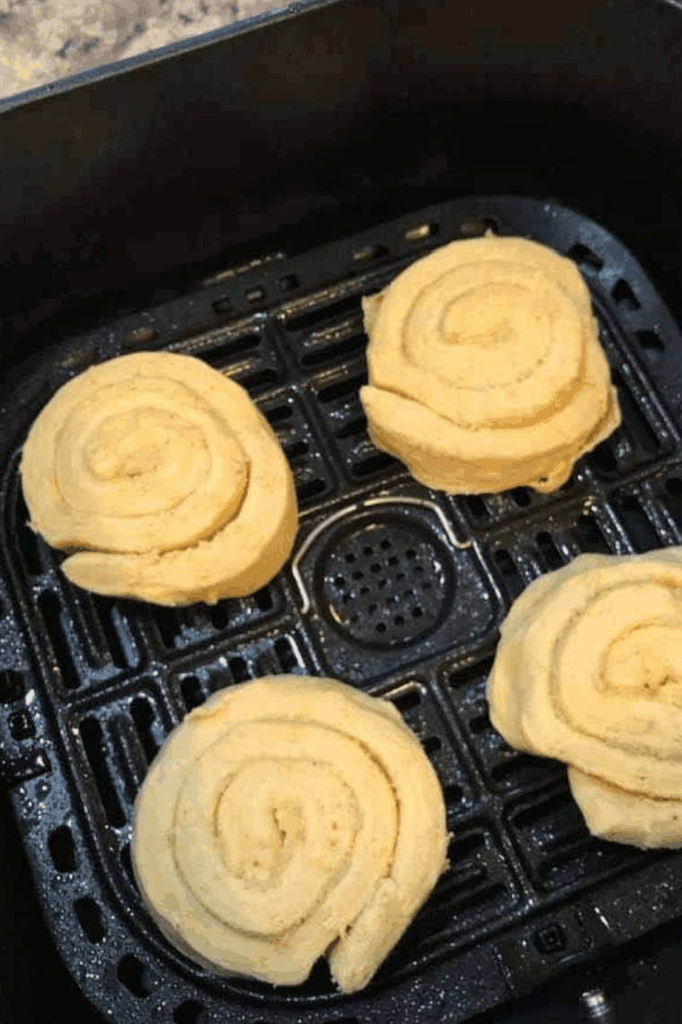 Place Canned Pumpkin Cinnamon Rolls in the air fryer basket.