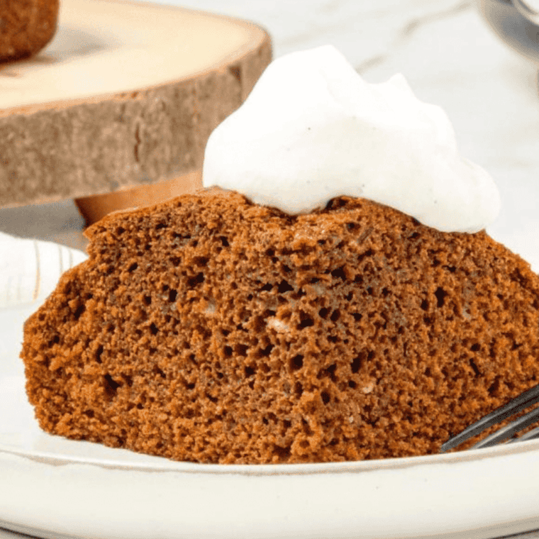 Air Fryer Gingerbread Cake with a soft, moist texture and a rich ginger flavor, topped with powdered sugar.