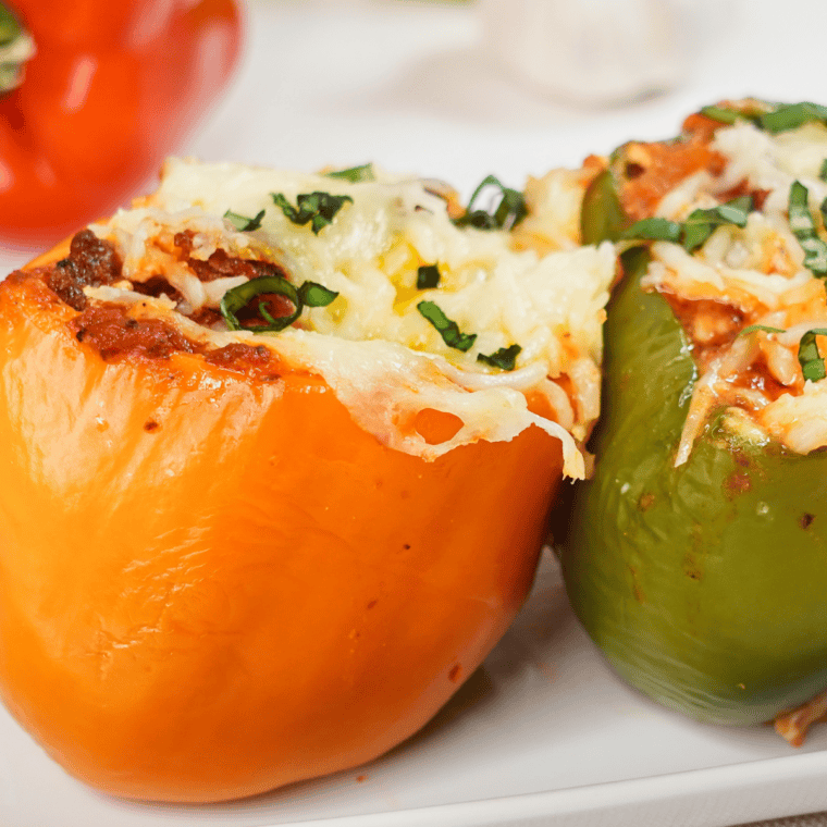 Air Fryer Lasagna Stuffed Peppers filled with seasoned beef, ricotta, marinara, and melted mozzarella cheese.