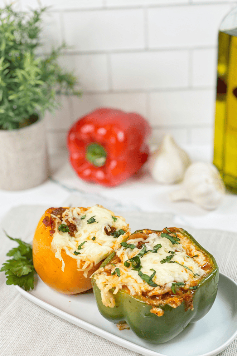 Air Fryer Lasagna Stuffed Peppers with seasoned beef, ricotta, marinara sauce, and melted mozzarella cheese.