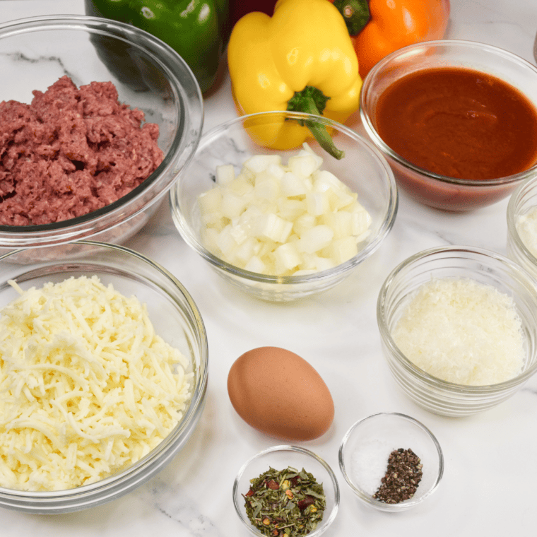 Ingredients needed for Air Fryer Lasagna Stuffed Peppers on kitchen table.