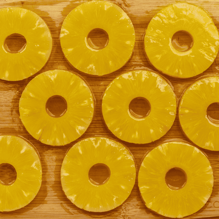 Ingredients needed for Air Fryer Rum Soaked Pineapple on kitchen table.