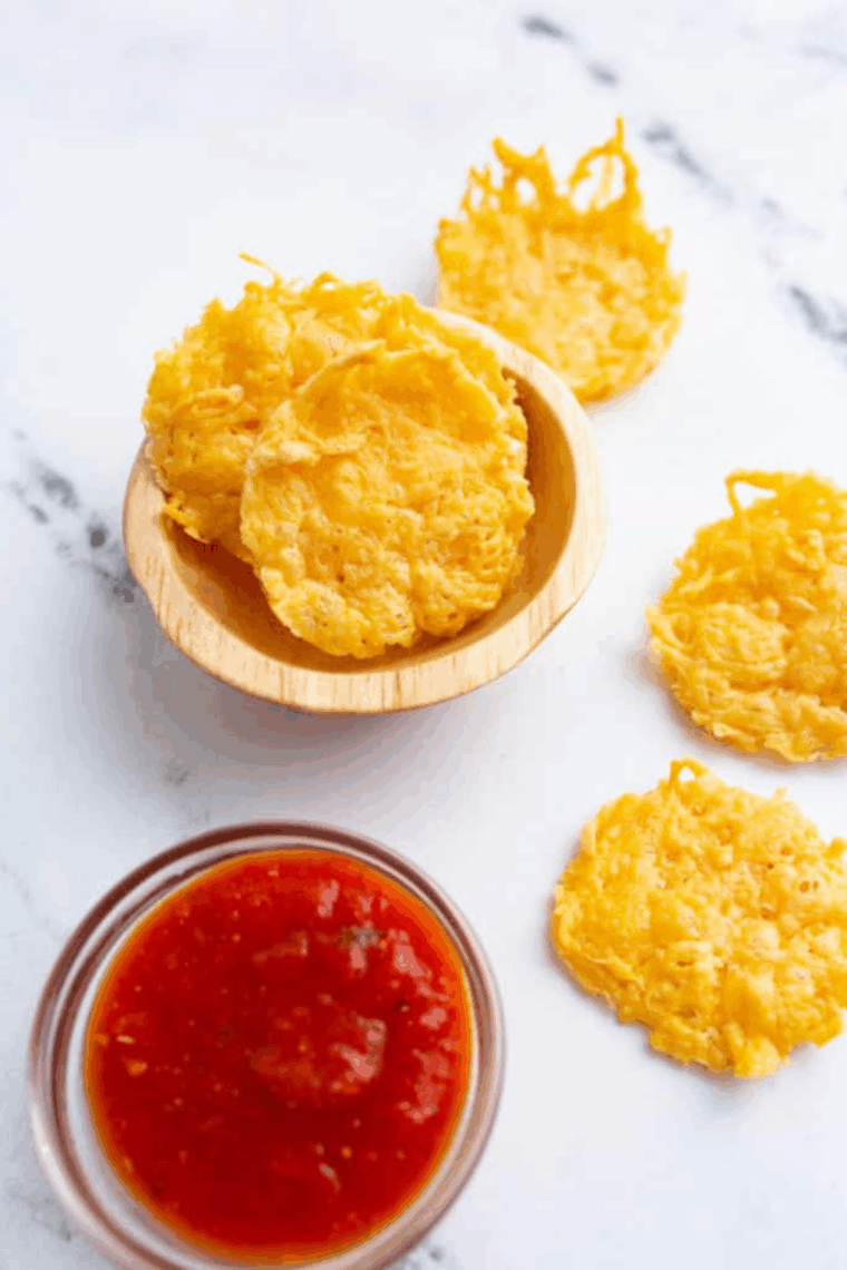 Golden, crispy Air Fryer Parmesan Crisps on a baking sheet, ready to serve.