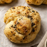 Soft, buttery air fryer garlic knots ready in just 15 minutes. Made with pizza dough and coated in a rich garlic-parmesan butter, they&rsquo;re crisp on the outside and light, fluffy, and tender inside.