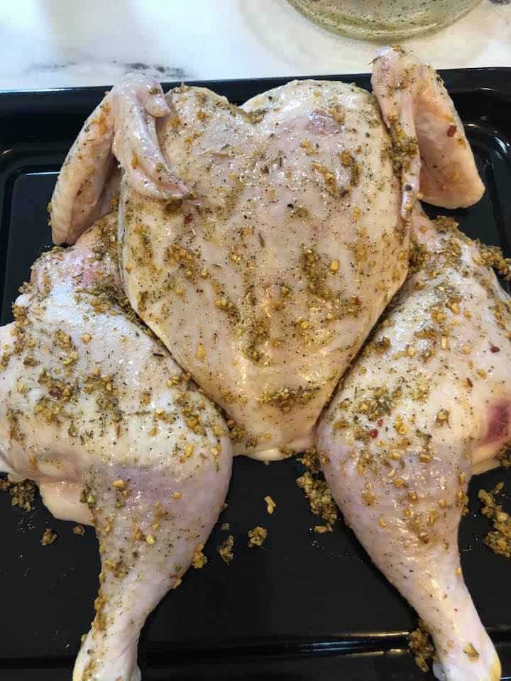 Step 2: Air fry the chicken
Place chicken in the air fryer and set the timer for 15 minutes at 375 degrees F. air fryer setting.

Then open the air fryer, brush more of the seasoning blend onto the chicken, and air fry for another 20-30 minutes at 375 degrees F, air fryer setting.
