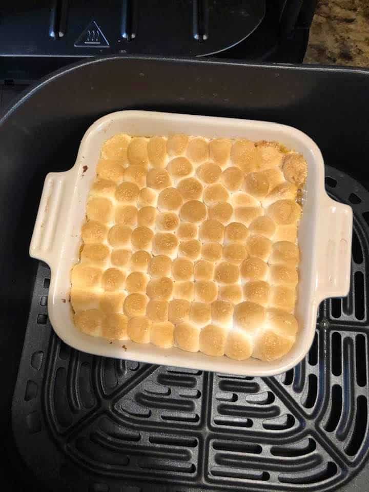 Sweet potato casserole after being baked with golden marshmallows on top. 