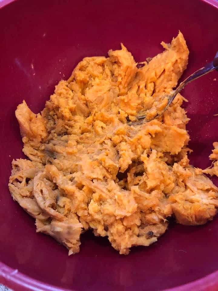 Smashed sweet potato in a bowl. 