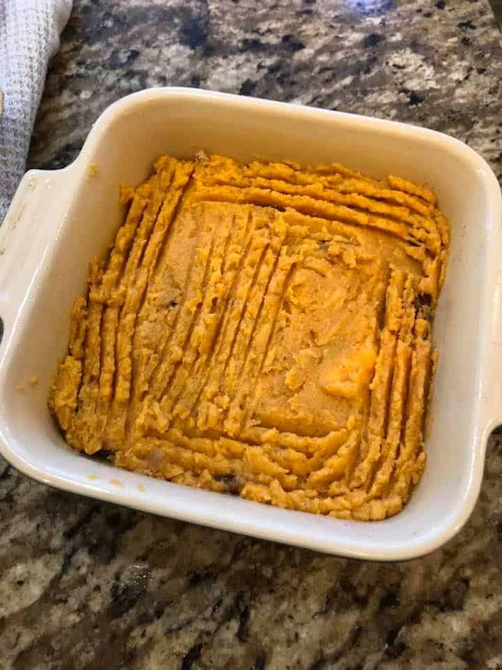 Sweet potato mixture in the baking dish. 