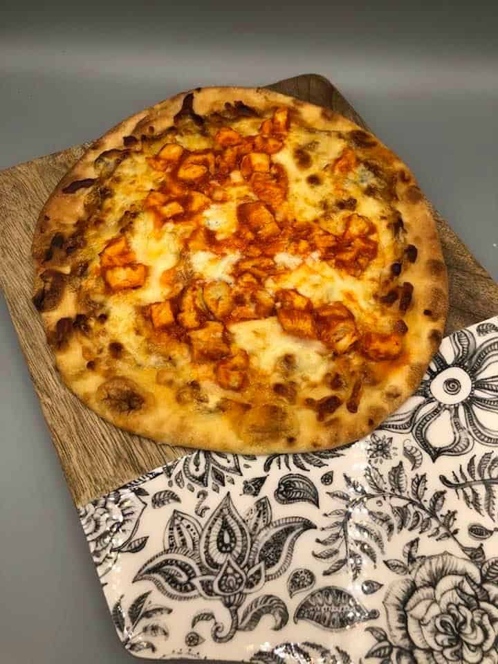 Air Fryer Naan Buffalo Chicken Pizza is one of the best and easy ways to transform any night into pizza night. I made this really simple pizza for my kids for lunch, and it was done in no time.