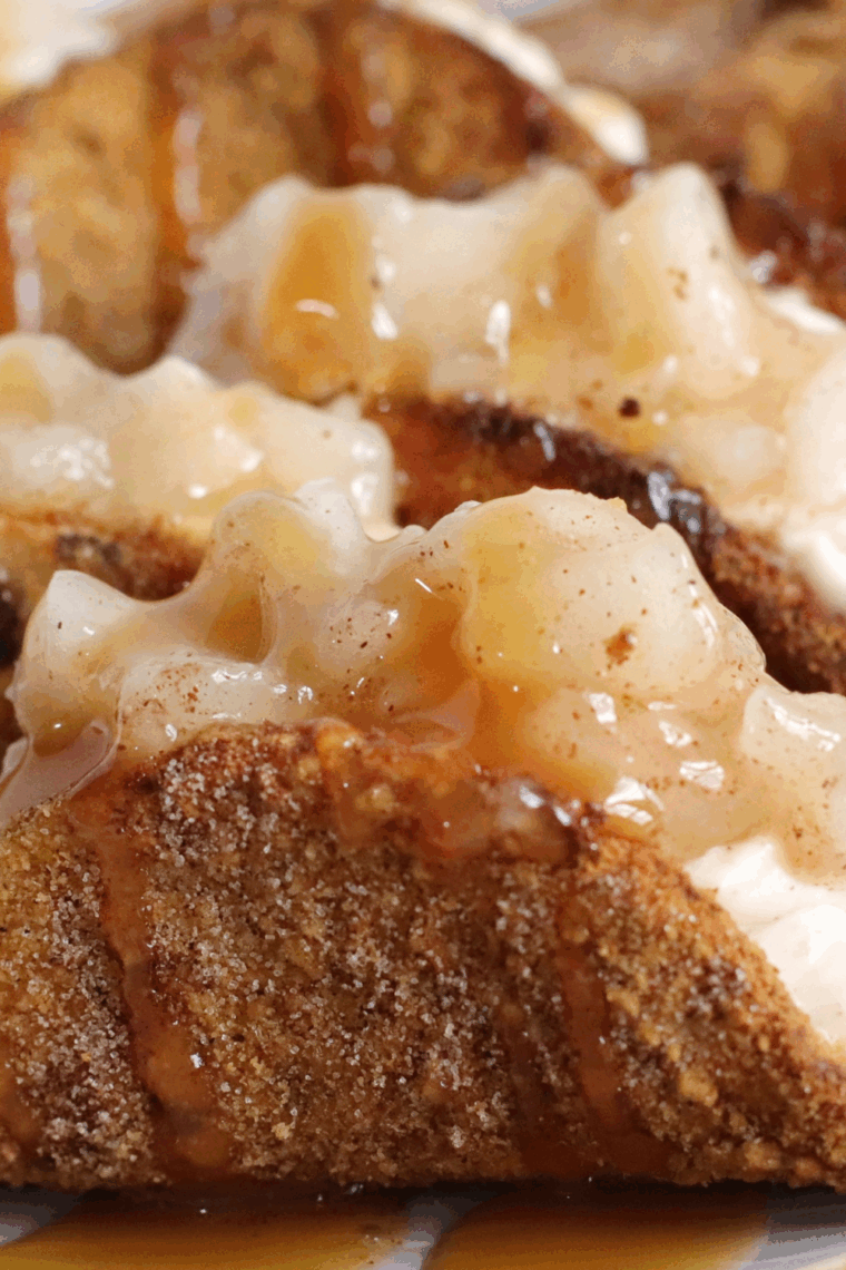 Crispy dessert tacos filled with creamy cheesecake and cinnamon-spiced apple filling.