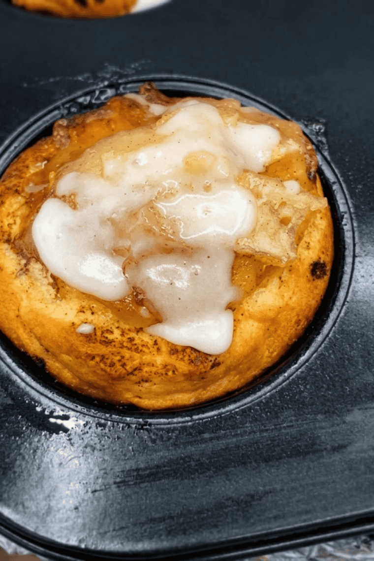 Two ingredients for apple pie cups &mdash; cinnamon rolls with icing and a bowl of apple pie filling