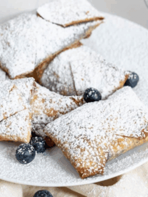These Easy Air Fryer Blueberry Cheesecake Egg Rolls feature a crispy, golden exterior with a creamy, sweet blueberry cheesecake filling. Perfect for a quick dessert or a fun treat, they&rsquo;re simple to make and irresistible to eat.