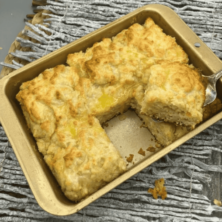 Close-up of fluffy butter swim biscuits fresh from the air fryer.