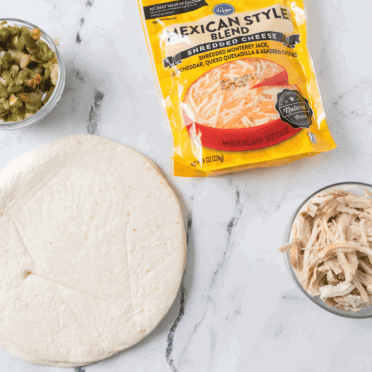 Ingredients needed for Air Fryer Chicken Quesadilla on kitchen table.