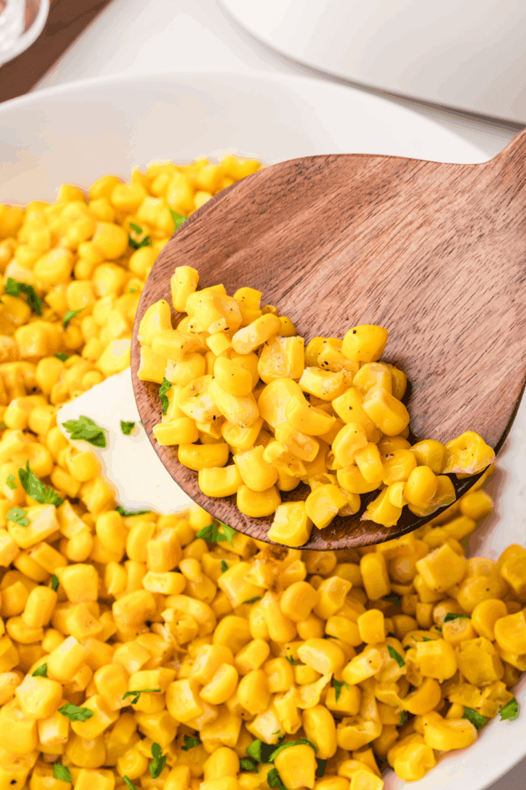 Crispy, golden air fryer frozen corn kernels served in a white bowl, ready as an easy side dish.