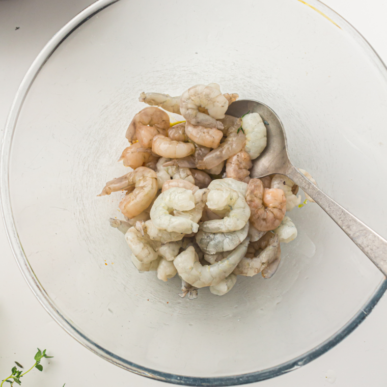 Peeling and deveining shrimp then patting dry with paper towels for best texture.