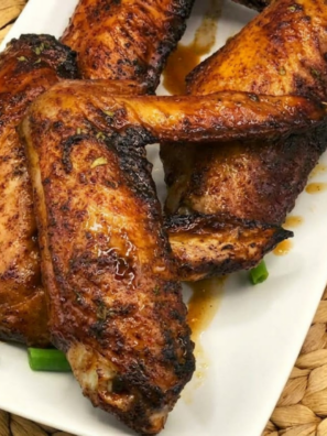 crispy air fryer honey roasted turkey wings glazed with honey and herbs on a plate