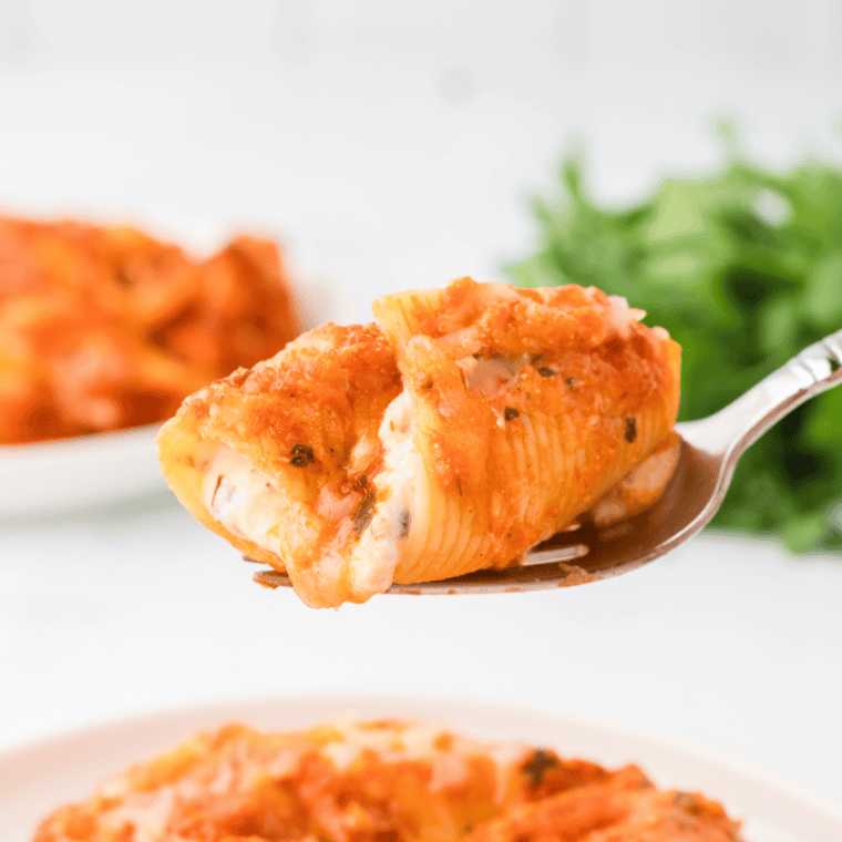 Air fryer stuffed shells with ricotta cheese filling and marinara sauce.