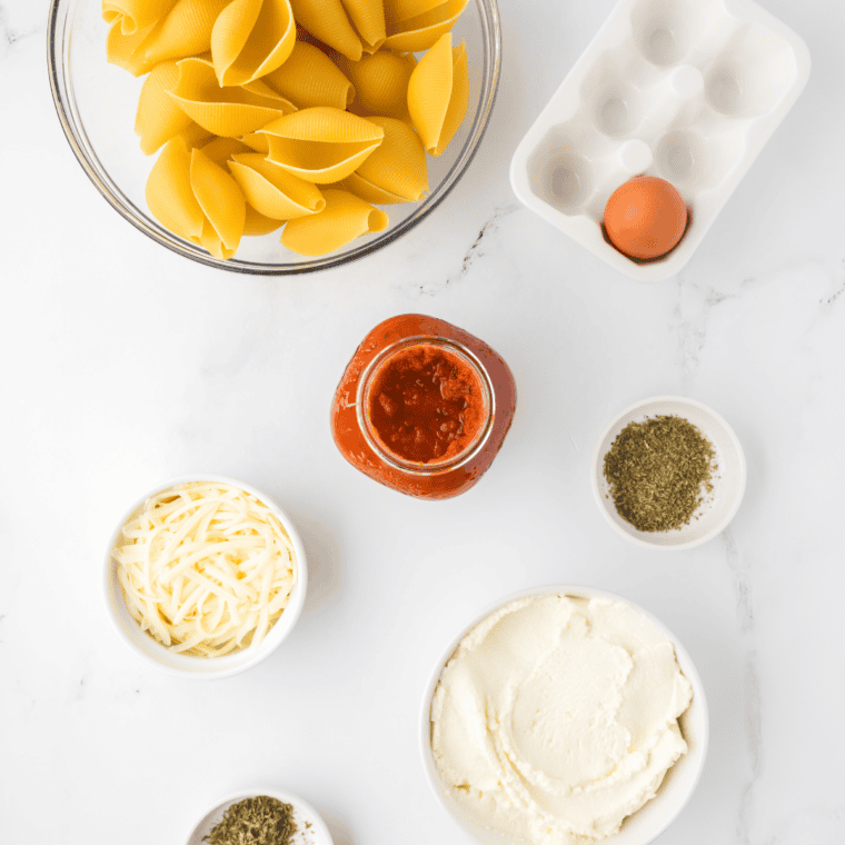 Ingredients needed for Air Fryer Stuffed Shells on kitchen table.