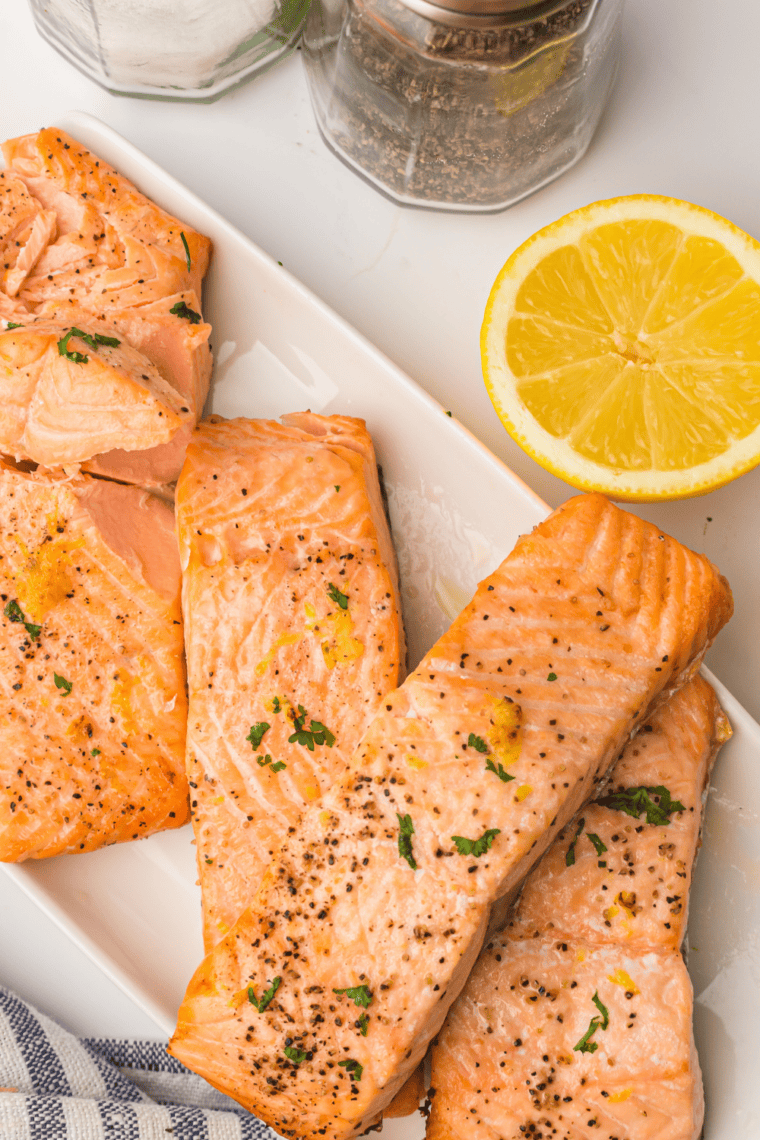 Close-up of juicy air fryer lemon Dijon salmon with a bright lemon and garlic glaze
