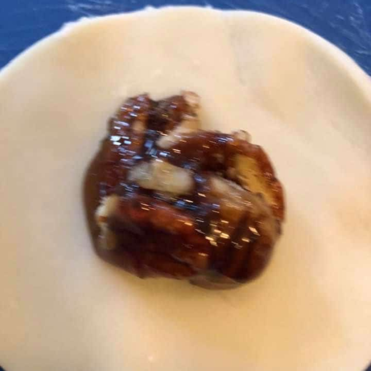 Mixing pecan pie filling ingredients in a bowl for hand pies