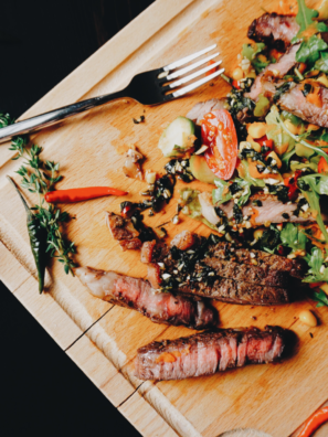 Air Fryer Garlic Butter Steak Salad with tender steak, fresh greens, and colorful vegetables.